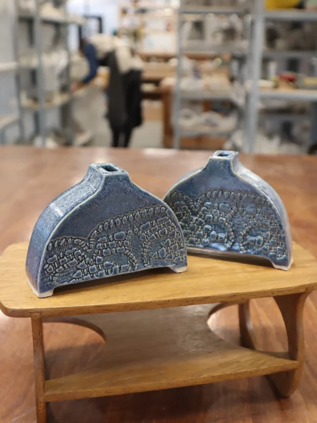 Two beautiful slabbed vases made by one of our regular potters, Mandy. With lace relief detail and glazed in our petrol blue, which is proving really popular with students.