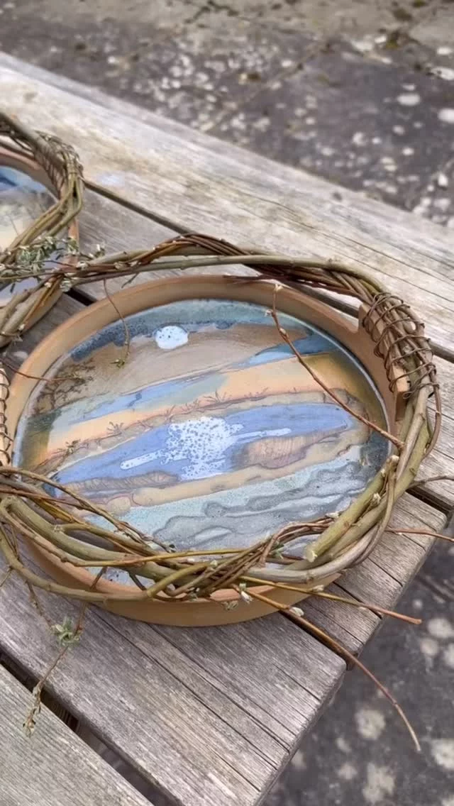 Time to reflect on our beautiful planet 🌎 as today is officially Earth Day! Although you could say every day is earth day when you are working with clay. 
These stunning pieces were made by Amanda for our mixed media project. She has cut fresh willow combined with wire to make the frame and illustrated the local landscapes featured by using a combination of underglaze pencils and glazes. 
So lovely to hear the birds singing their Spring songs too. 
Absolutely gorgeous, we’re sure you’d agree.
