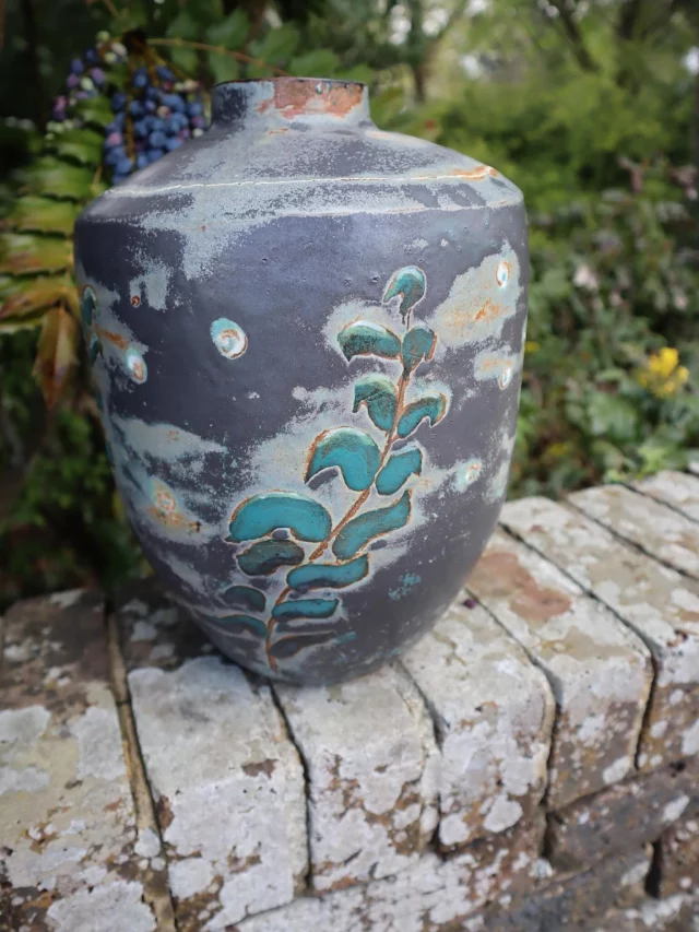 This stunning vase, glazed in speckled turquoise was made by Jan from our Tuesday morning class.
The smoky grey surface, rust-toned breaks and turquoise botanical detailing all work beautifully together, creating something that feels earthy, organic and full of quiet character.