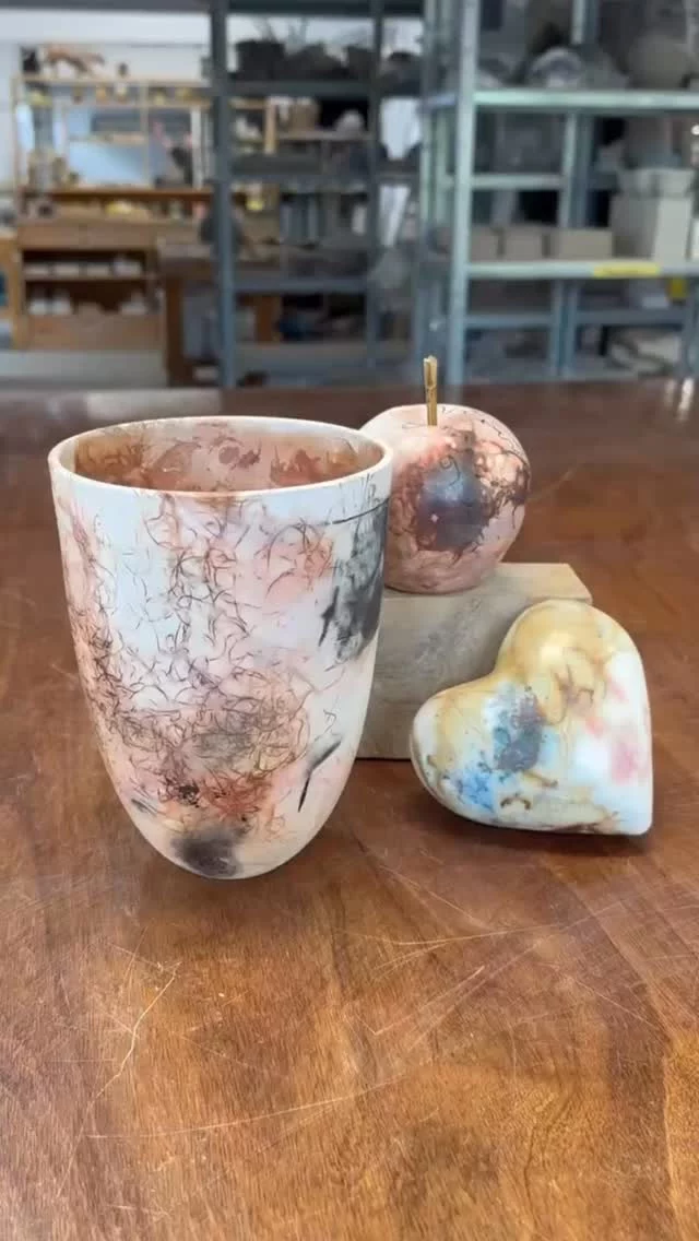 These beautiful pieces have all been through a Saggar firing. 
The interesting markings and colouration are caused by combustibles such as seaweed, banana skins or coffee grounds and the application of oxides. 
Sealed in a wrapping of clay and foil, these materials burn into the surface of the pot under the extreme heat of the firing, yielding fascinating results. 
We have just one space left on our Saggar Barrel Firing Workshop, led by Helen Ashton @helen.ceramics taking place on the evening of Friday 3rd July and afternoon of Saturday 4th (for the reveal!)
If you’d like to join us, please head over to our website theclay.studio where you’ll find all the details.