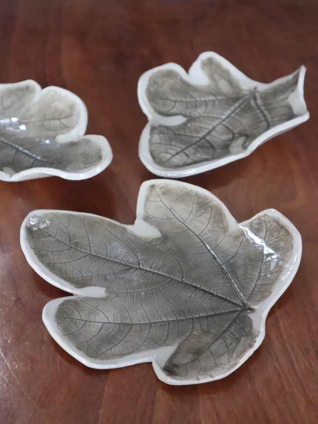 Using fig leaves to create this texture, pressed into the clay with oxide added at bisque, then glazed in transparent.